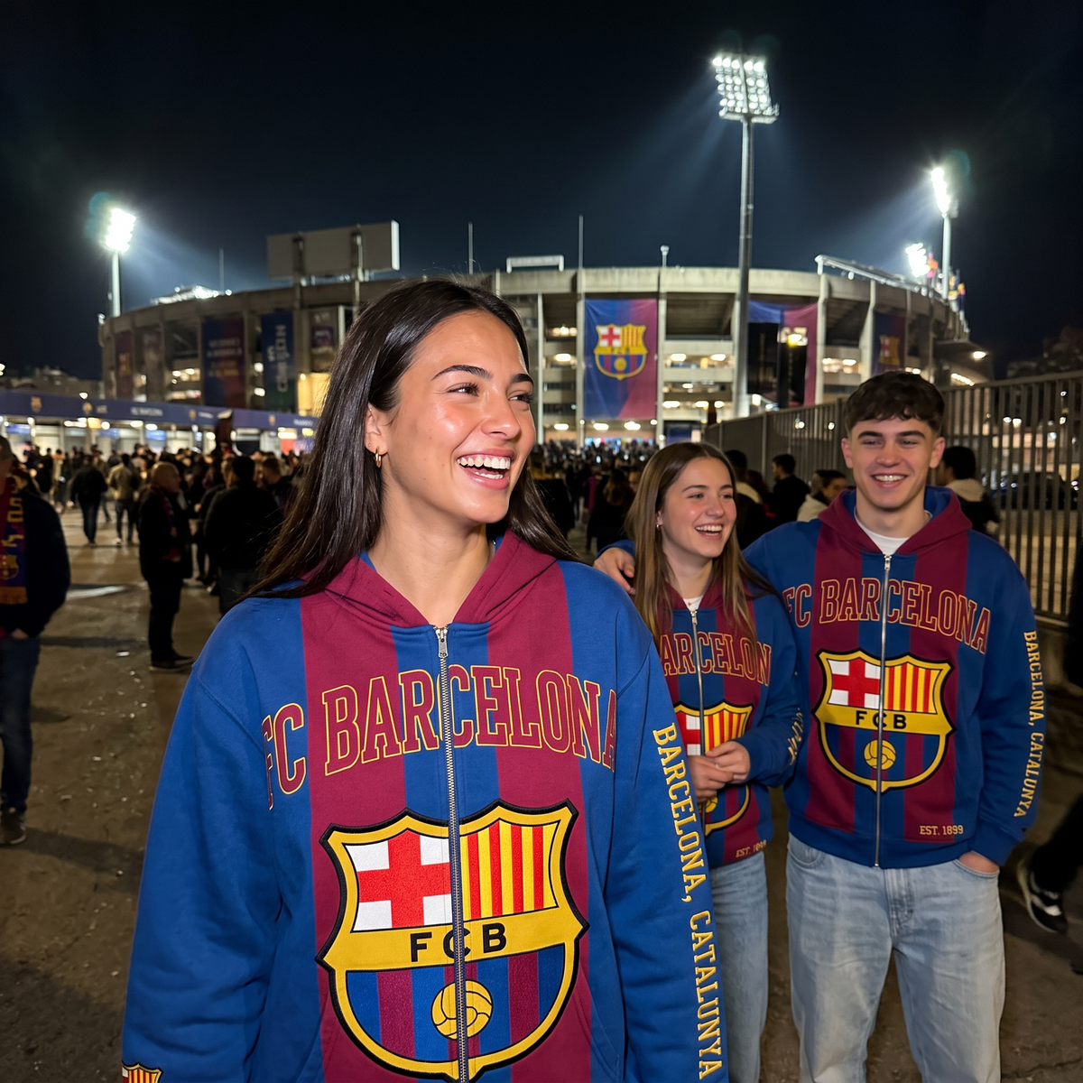 Three friends wearing the FC Barcelona MatchWorn hoodie at the ground